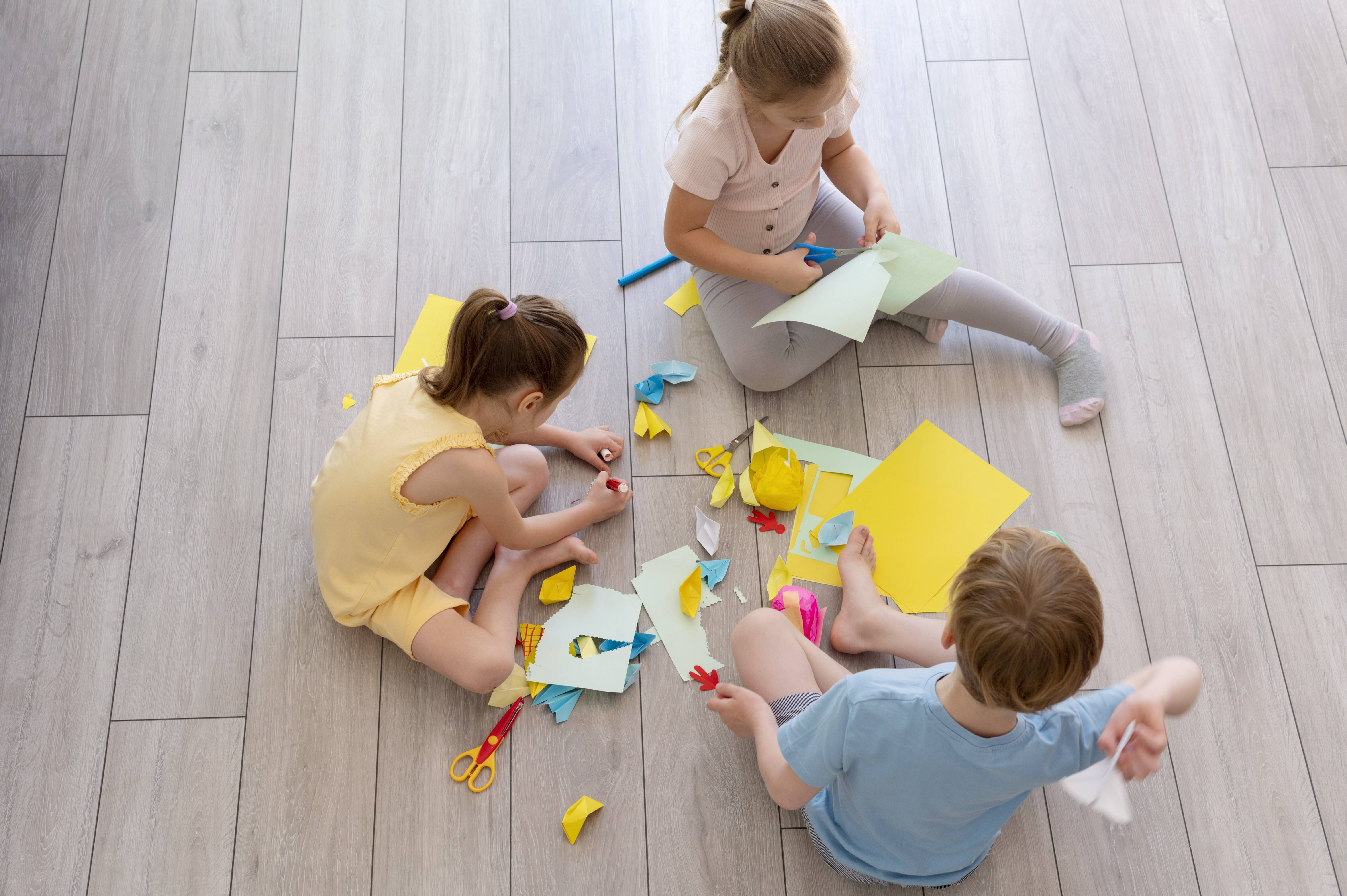 children-playing-with-paper-full-shot.jpg