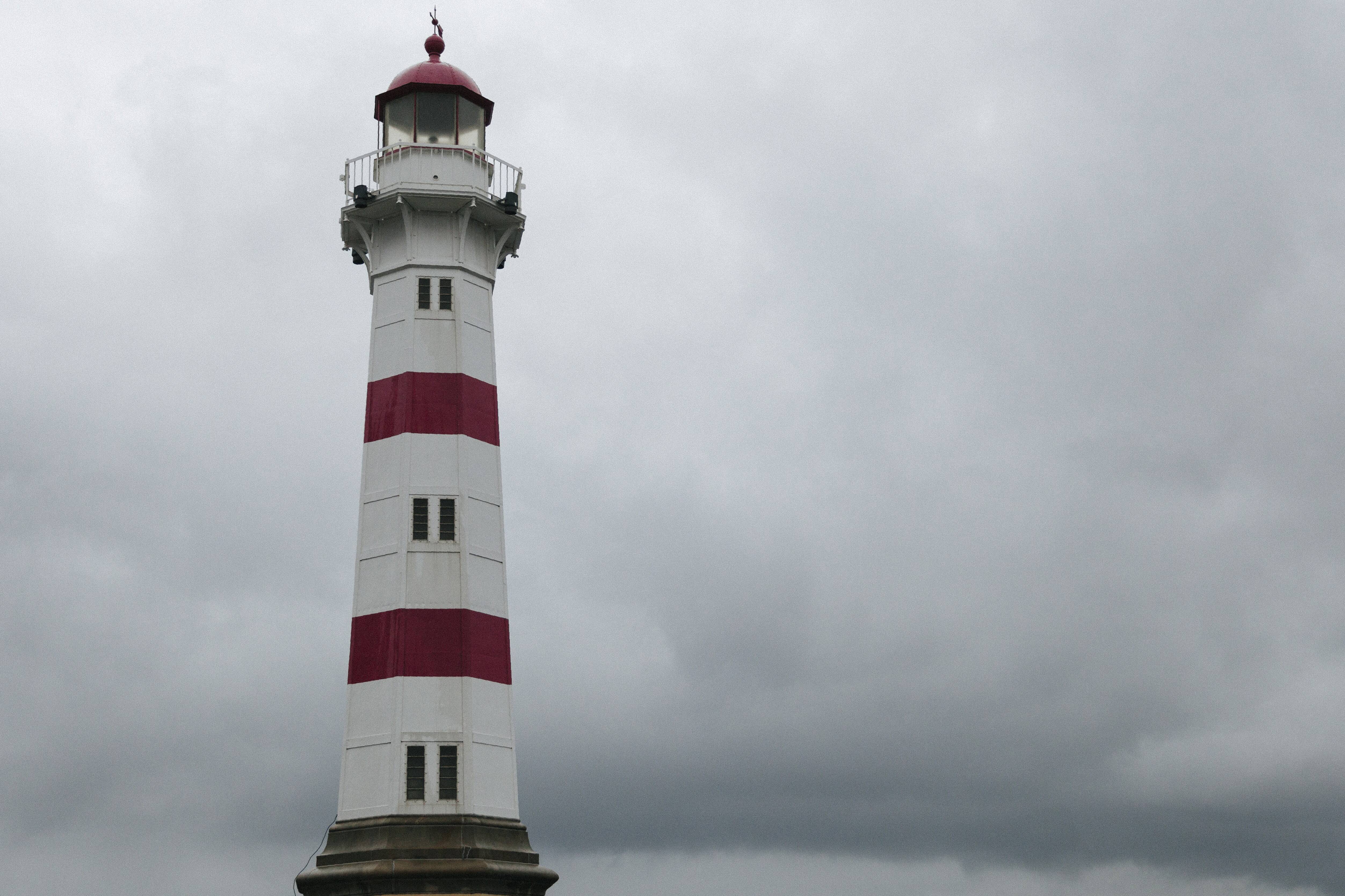 lighthouse-against-dark-overcast-sky.jpg