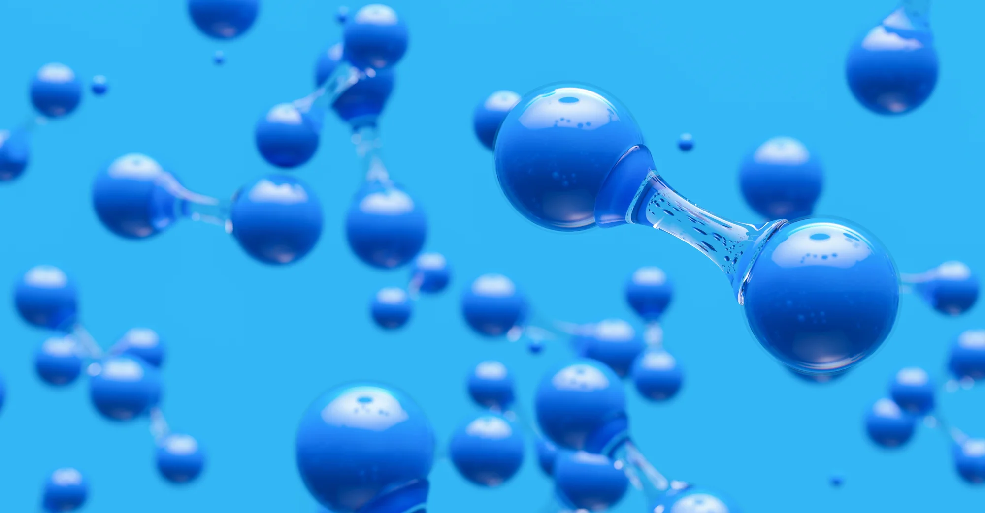 Representación tridimensional de moléculas con esferas azules unidas por enlaces, sobre fondo azul claro.