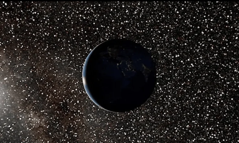 Representación digital de la Tierra mayormente en oscuridad, rodeada de estrellas y la Vía Láctea al fondo.