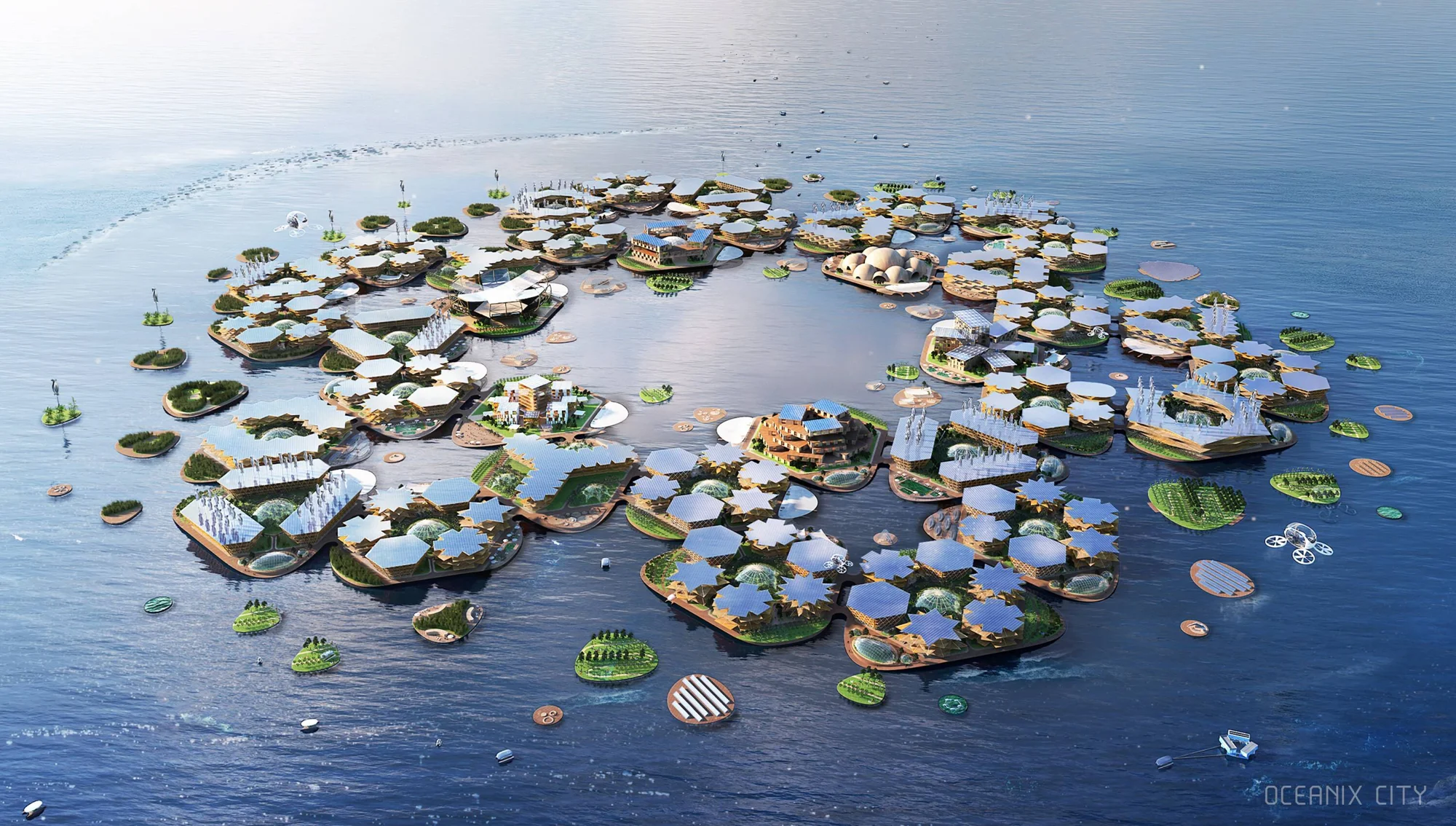 Renderizado aéreo del concepto Oceanix City: plataformas hexagonales interconectadas con paneles solares y vegetación flotando en el océano.