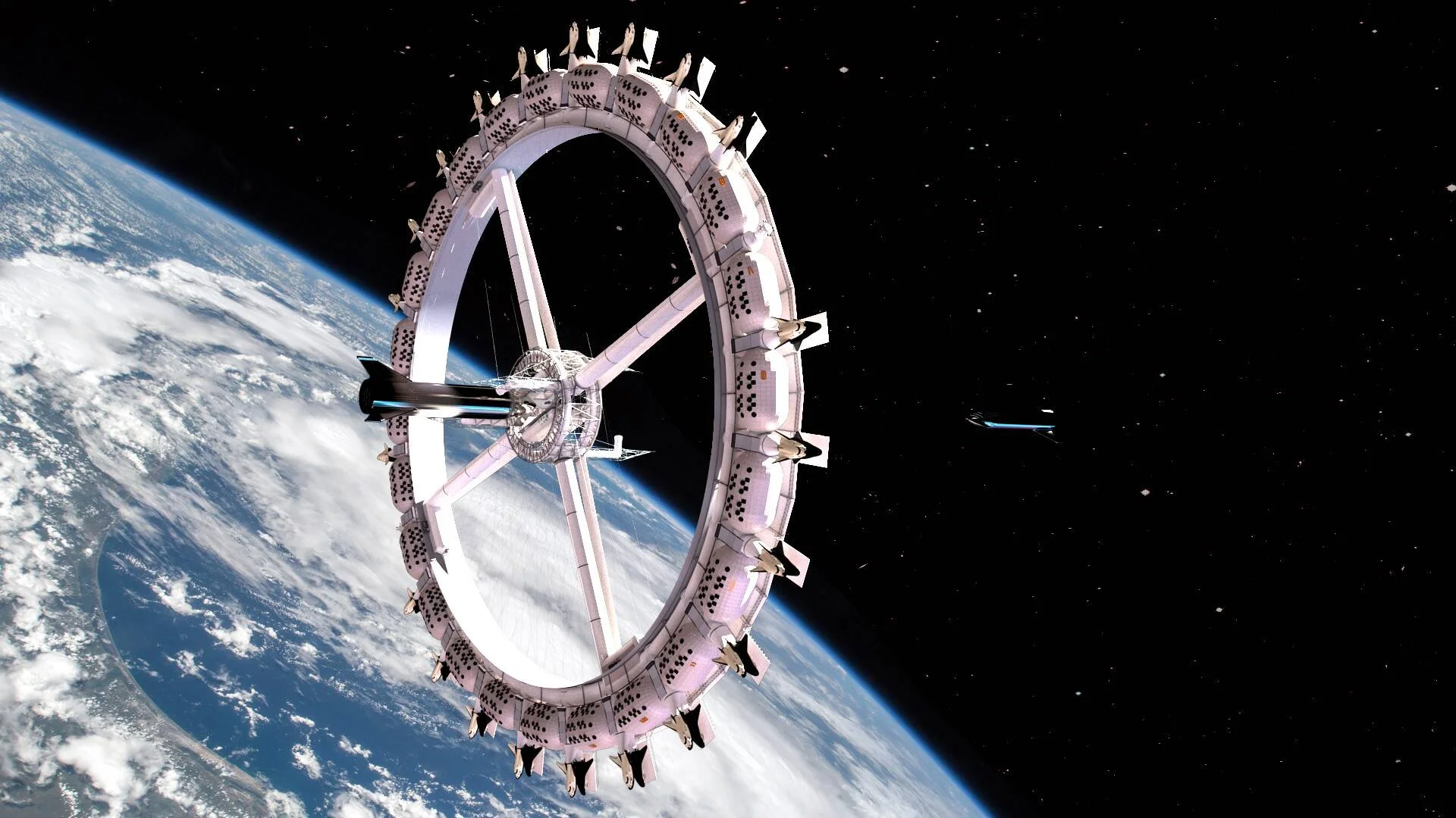 Render de una estación espacial con forma de rueda giratoria orbitando sobre la Tierra, con nubes visibles bajo ella.