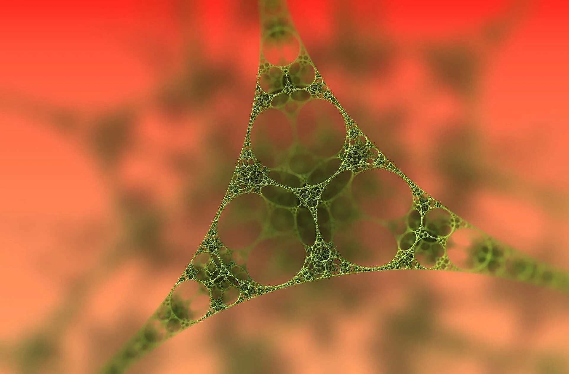 Estructura fractal con forma triangular de intrincados círculos y redes verdes sobre fondo rojo difuminado.