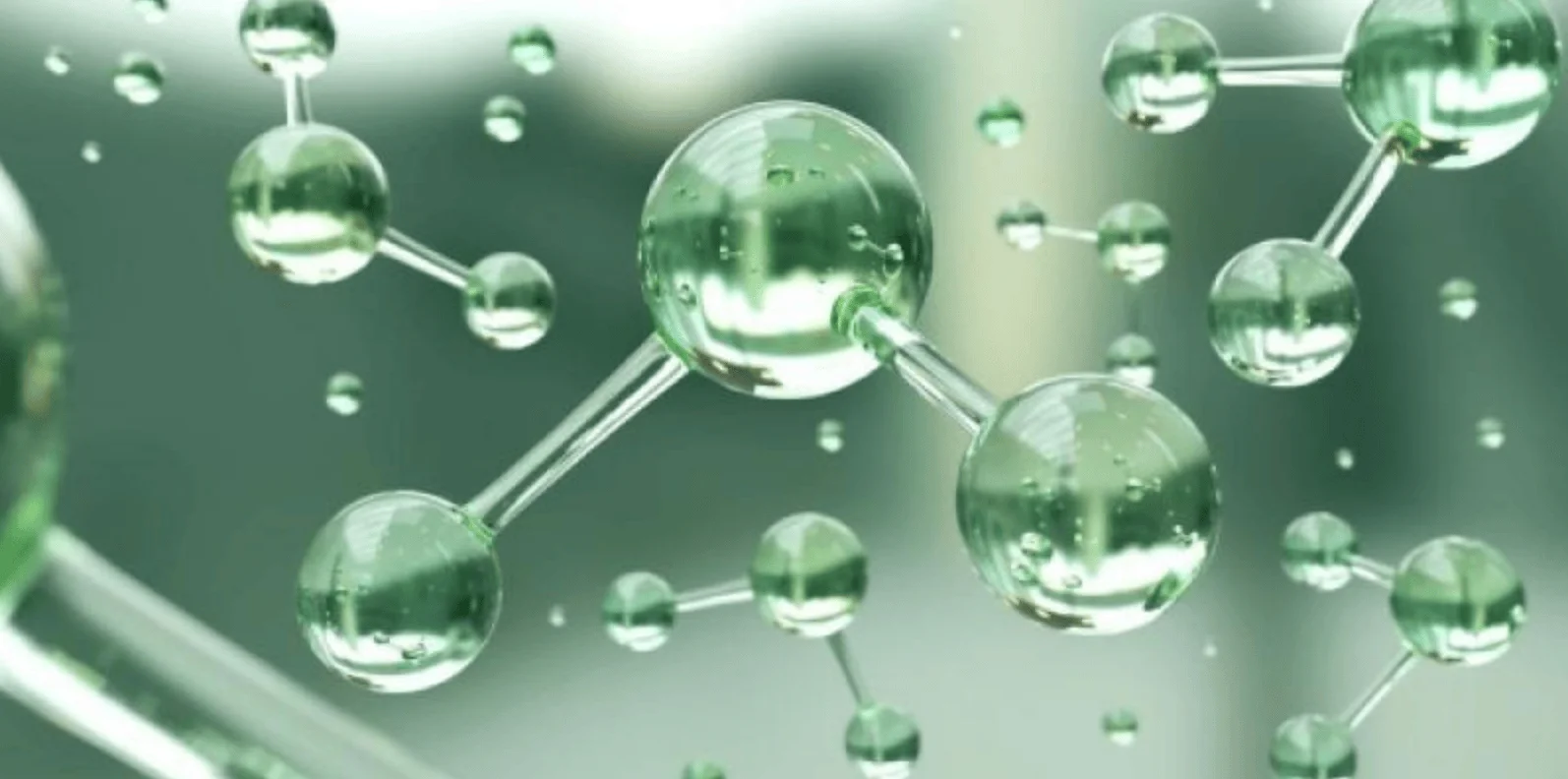 Representación tridimensional de moléculas con esferas y enlaces en tonos verdes, evocando hidrógeno verde o química sostenible.