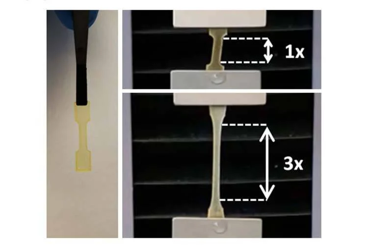 Comparación de una muestra de material flexible en estado original (1x) y estirada al triple de su longitud (3x) en un ensayo de tracción.