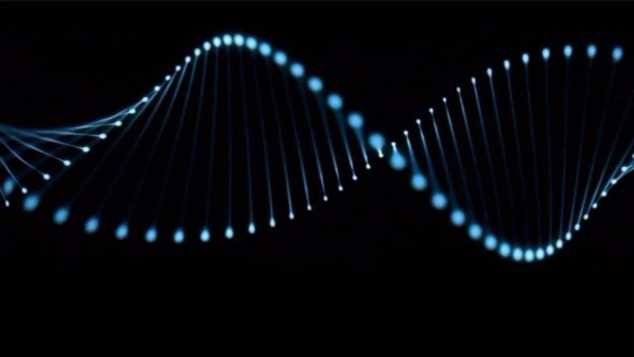 Representación digital de una doble hélice de ADN con puntos luminosos azules sobre fondo negro.