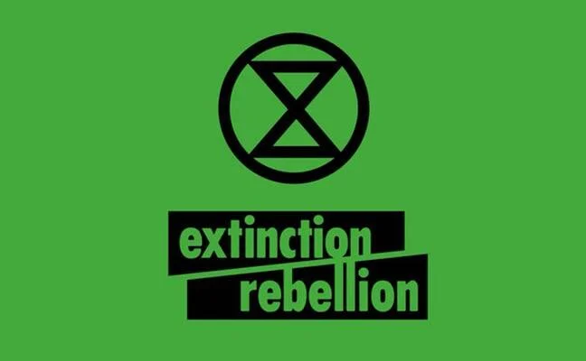 Logotipo de Extinction Rebellion: símbolo de reloj de arena dentro de un círculo sobre fondo verde con el nombre del movimiento.
