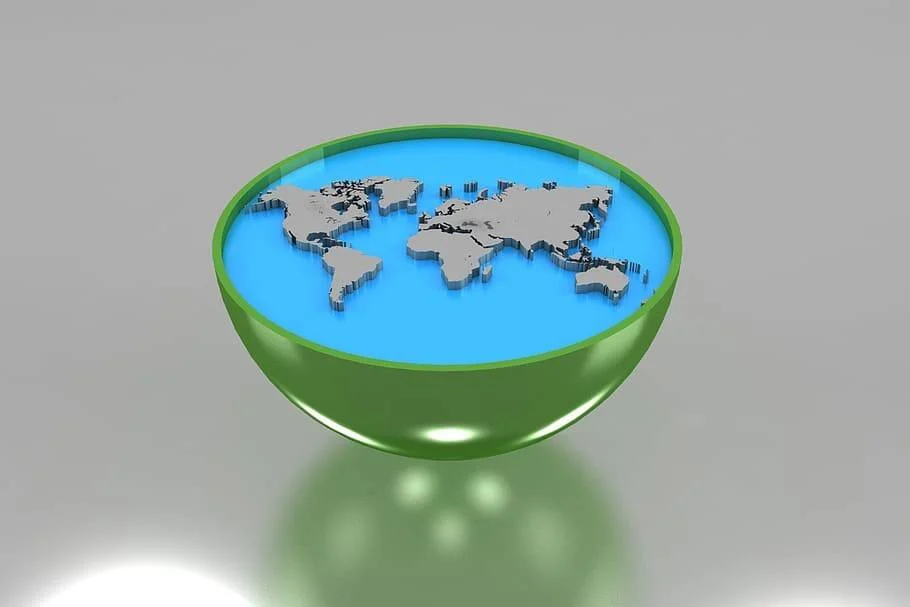 Ilustración 3D de un cuenco verde que contiene un mapa mundial en relieve sobre fondo azul, simbolizando el planeta Tierra.