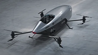 Monoplaza volador eléctrico con múltiples rotores tipo dron, diseño aerodinámico plateado y rojo, posado en superficie gris.